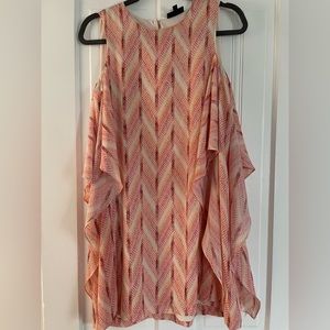Pink float dress with flowy ruffle detail down the sides
